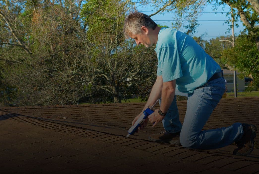 man working on roof