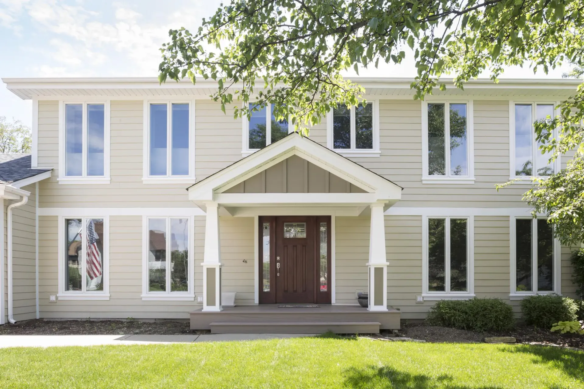 two story home with tall windows